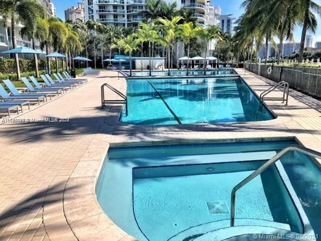 view of swimming pool with a patio area