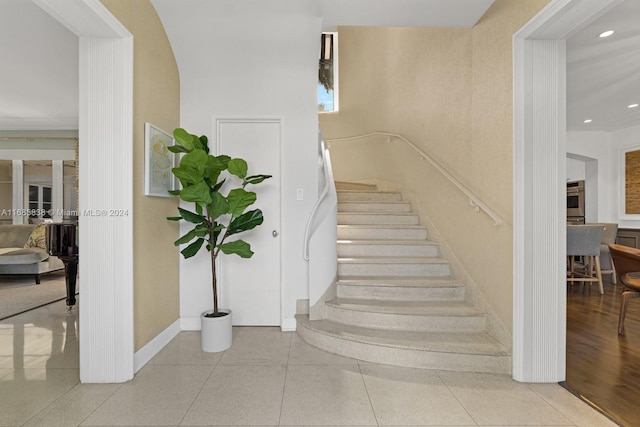 staircase featuring hardwood / wood-style flooring