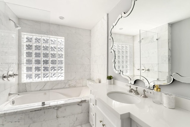 bathroom with vanity and tiled shower / bath combo