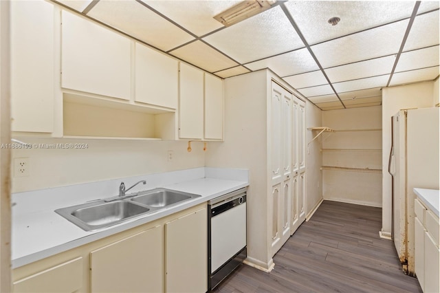 kitchen featuring a paneled ceiling, sink, white appliances, and dark hardwood / wood-style floors