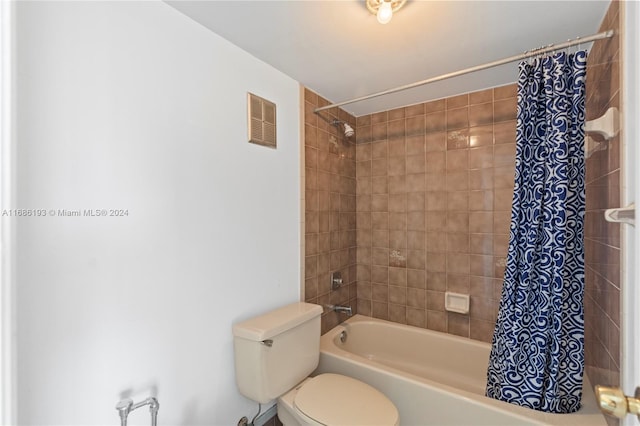 bathroom with toilet and shower / tub combo