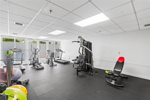 workout area with a drop ceiling