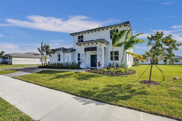 mediterranean / spanish home with a front yard