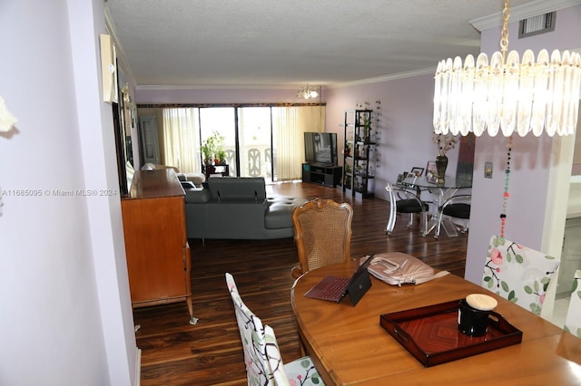 dining area with ornamental molding, a textured ceiling, and dark hardwood / wood-style floors