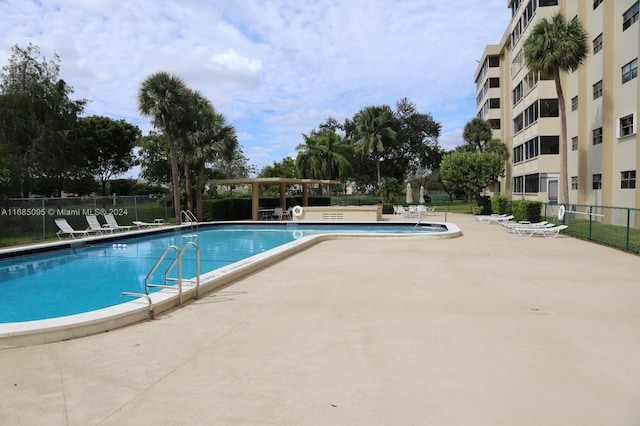 view of swimming pool featuring a patio