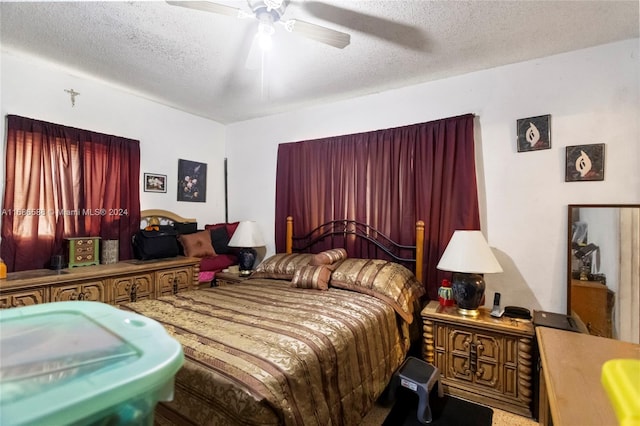 bedroom featuring a textured ceiling and ceiling fan