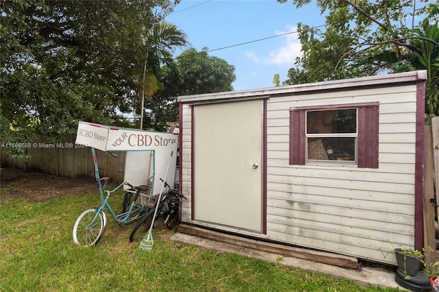 view of outbuilding featuring a yard