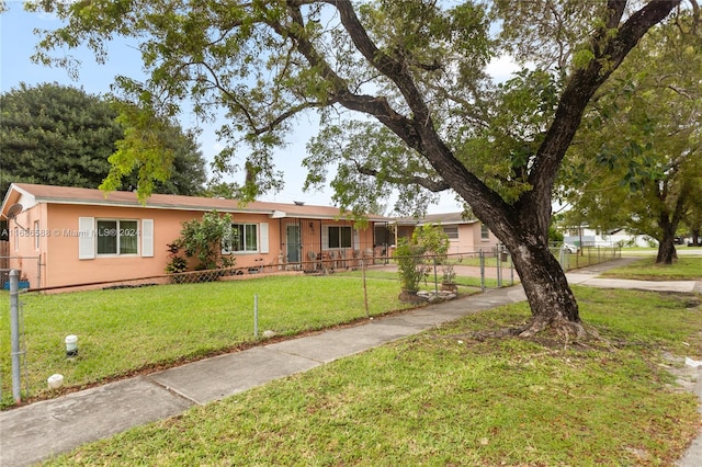 single story home featuring a front yard