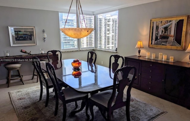 dining area featuring ornamental molding