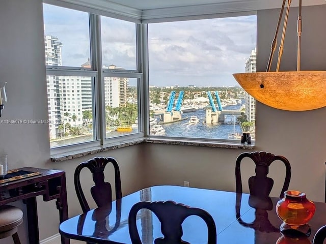 dining area featuring a water view