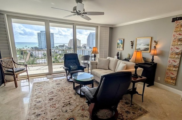 living room with ornamental molding, a water view, ceiling fan, and a healthy amount of sunlight