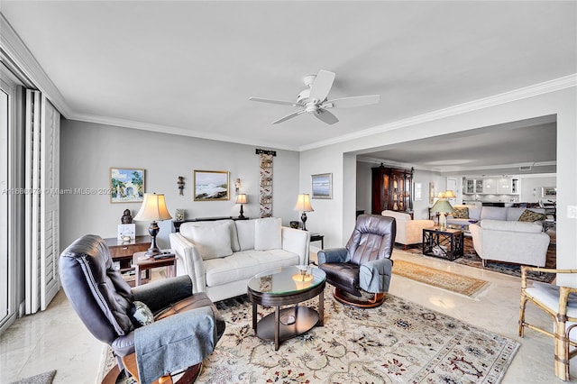 living room featuring ceiling fan and ornamental molding