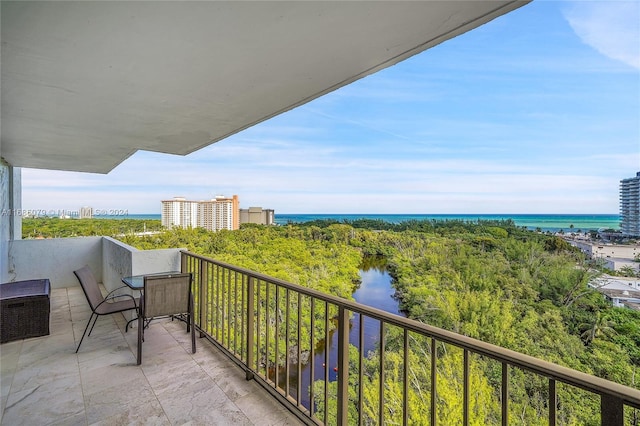 balcony featuring a water view