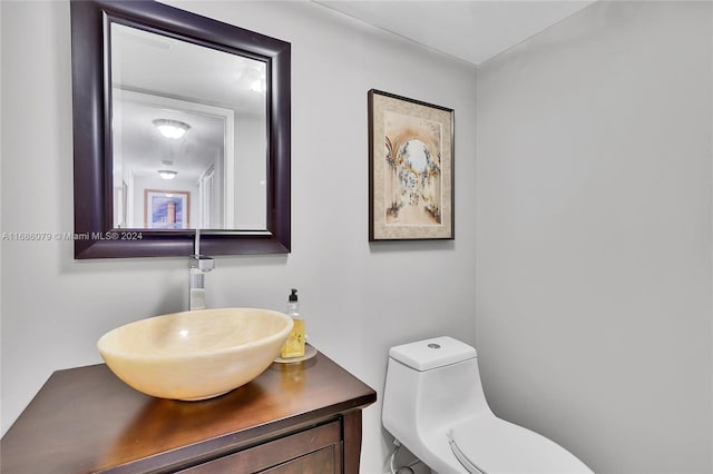 bathroom with vanity and toilet