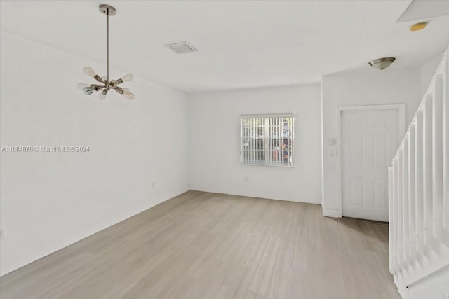 spare room with light hardwood / wood-style flooring and ceiling fan