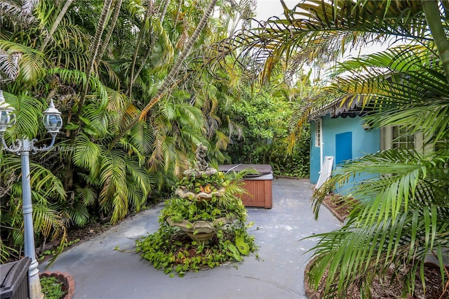 view of patio / terrace featuring a hot tub