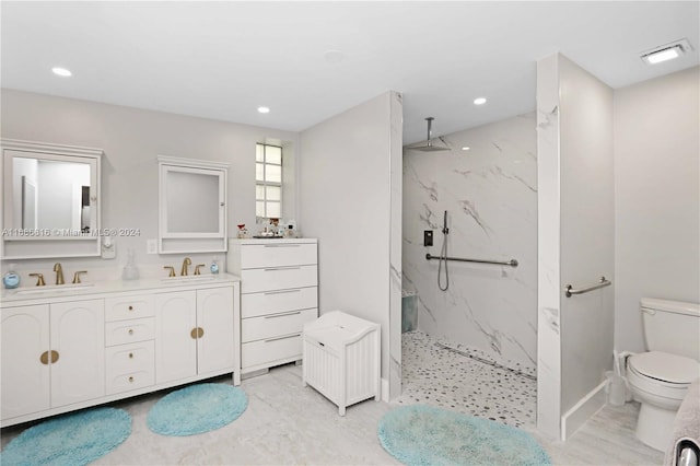 bathroom featuring a tile shower, wood-type flooring, radiator, toilet, and vanity