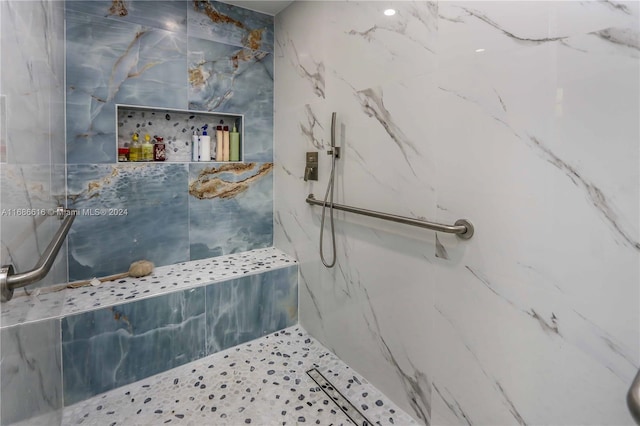 bathroom with tiled shower