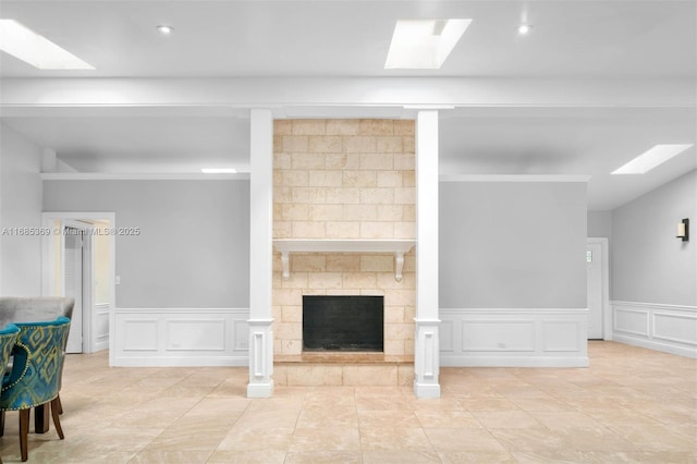 living room with light tile patterned floors and a fireplace