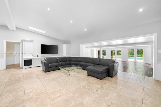 tiled living room featuring lofted ceiling with beams