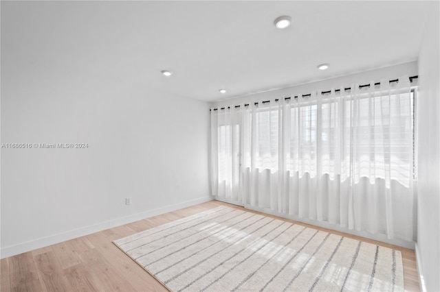 unfurnished room featuring light hardwood / wood-style floors