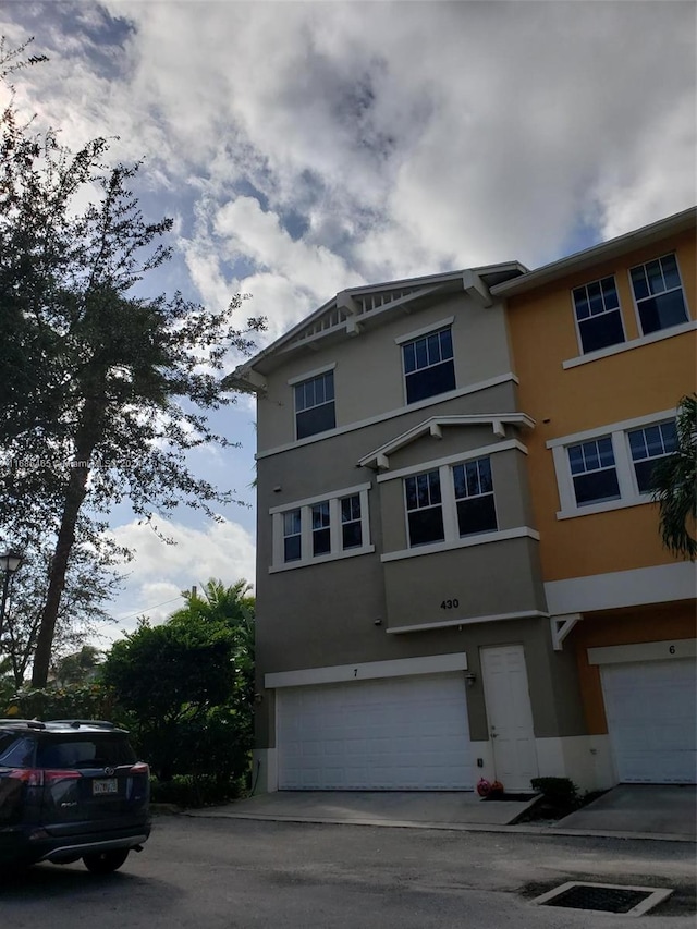 833 Millbrae Ct Unit 5, West Palm Beach, FL 33401 - multi unit property with stucco siding, an attached garage, and driveway