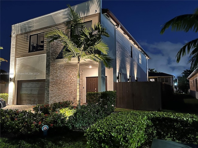 property exterior at twilight with a garage