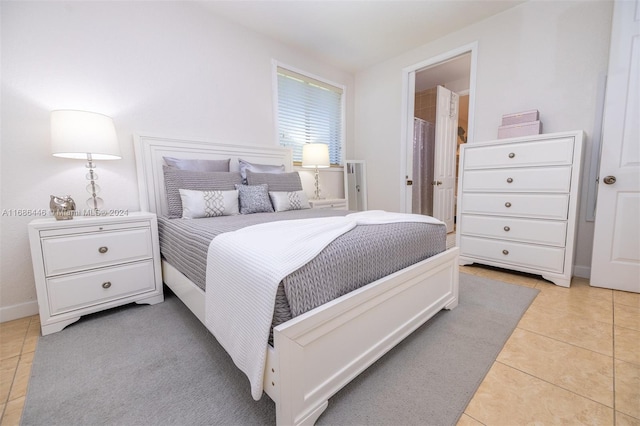 bedroom with light tile patterned floors