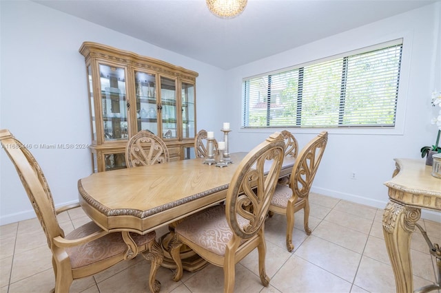 dining space featuring light tile patterned floors