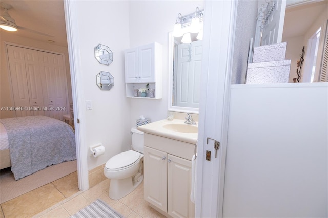 bathroom featuring vanity, toilet, and tile patterned floors