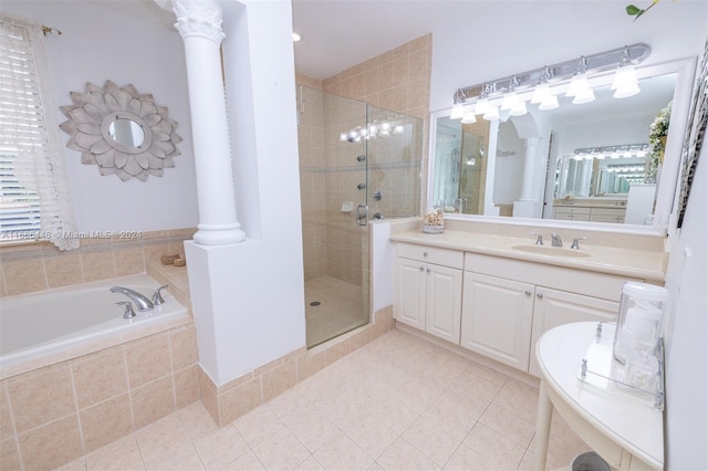 bathroom featuring vanity, decorative columns, plus walk in shower, and tile patterned flooring