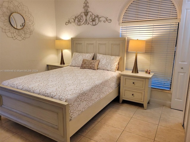 bedroom featuring light tile patterned flooring