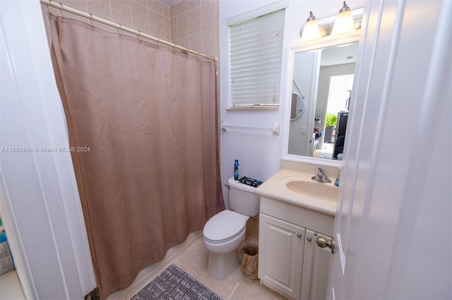 bathroom with vanity, walk in shower, toilet, and tile patterned floors