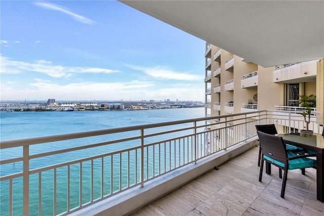 balcony featuring a water view