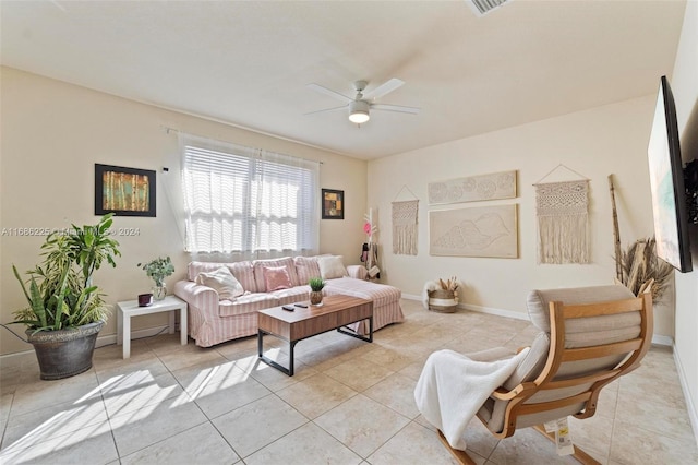 tiled living room with ceiling fan