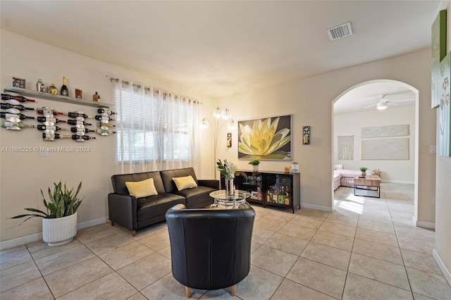 living room featuring ceiling fan and light tile patterned floors