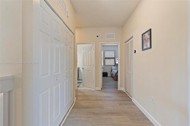 hall featuring light hardwood / wood-style flooring