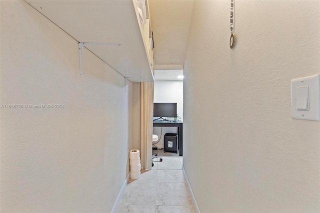 hallway featuring light tile patterned floors