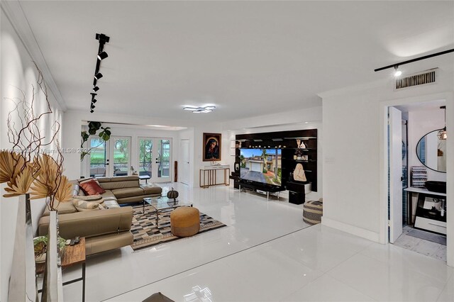 dining space featuring crown molding, tile patterned flooring, and a towering ceiling