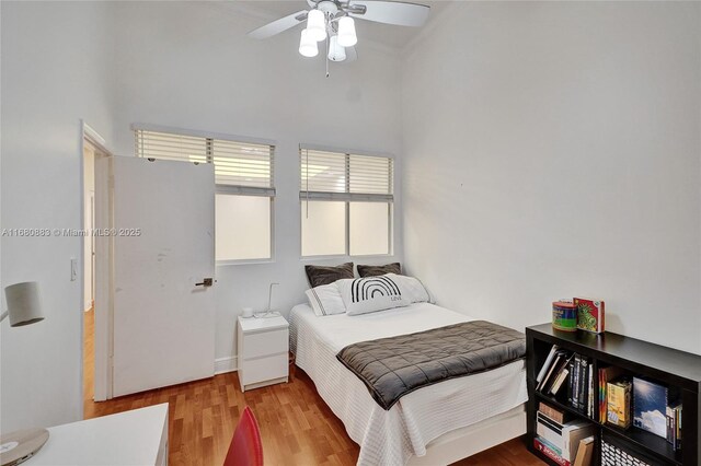 bedroom featuring light wood-type flooring and ceiling fan