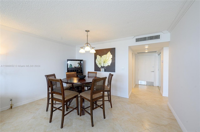 dining room featuring a notable chandelier, ornamental molding, a textured ceiling, and light tile patterned floors