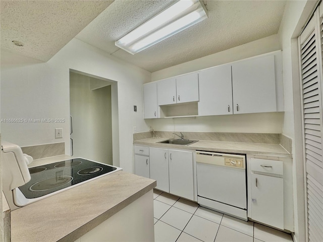 kitchen featuring light tile patterned floors, white dishwasher, a sink, white cabinetry, and light countertops