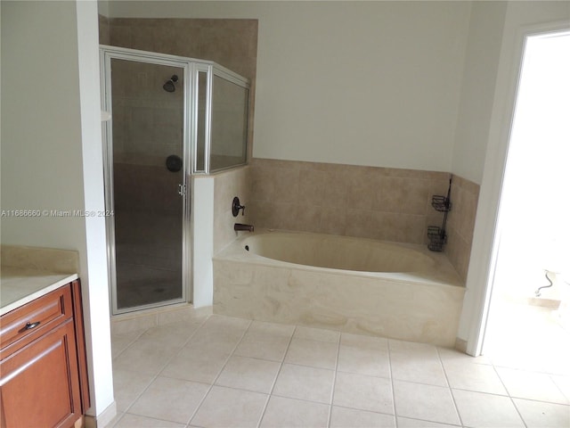 bathroom with vanity, tile patterned floors, and separate shower and tub