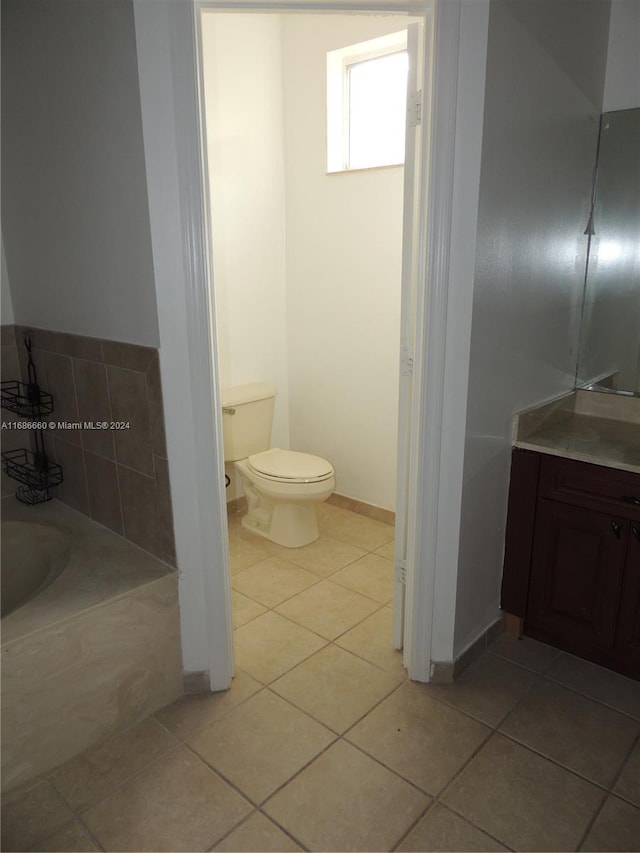 bathroom with tile patterned floors and toilet