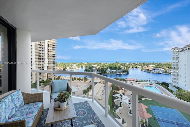 balcony featuring a water view