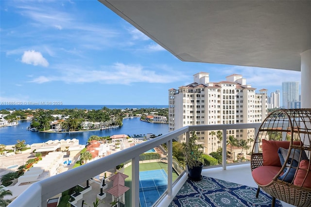 balcony featuring a water view