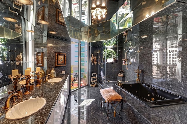 bathroom featuring vanity, tile walls, and a tub