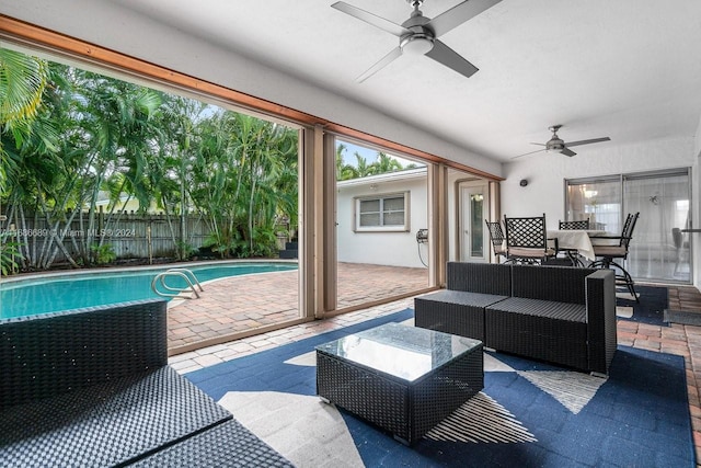 exterior space featuring ceiling fan