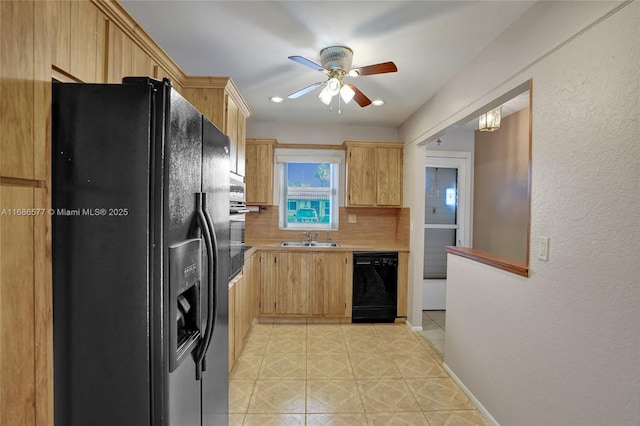 kitchen with light brown cabinetry, backsplash, ceiling fan, sink, and black appliances