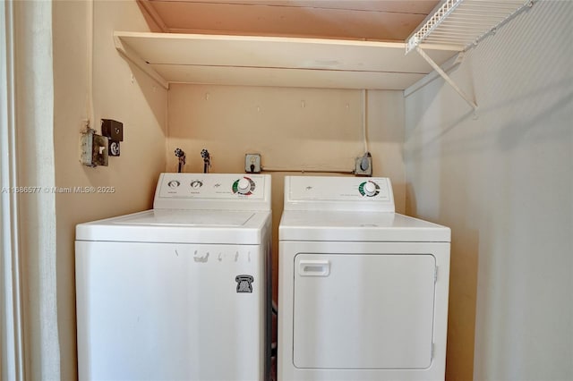 washroom featuring washer and dryer